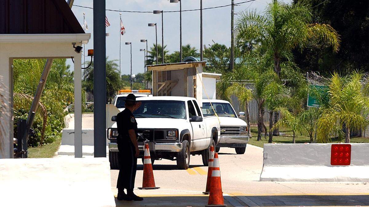 A Manatee County Sheriff’s Office deputy directs drivers to drive around the concrete barricades at the Manatee County Jail Complex as they exit the facility Wednesday afternoon. The Sheriff’s Office placed the staggered barriers to prevent vehicles from entering the area at high-speed in response to the Post-September 11 security concerns.