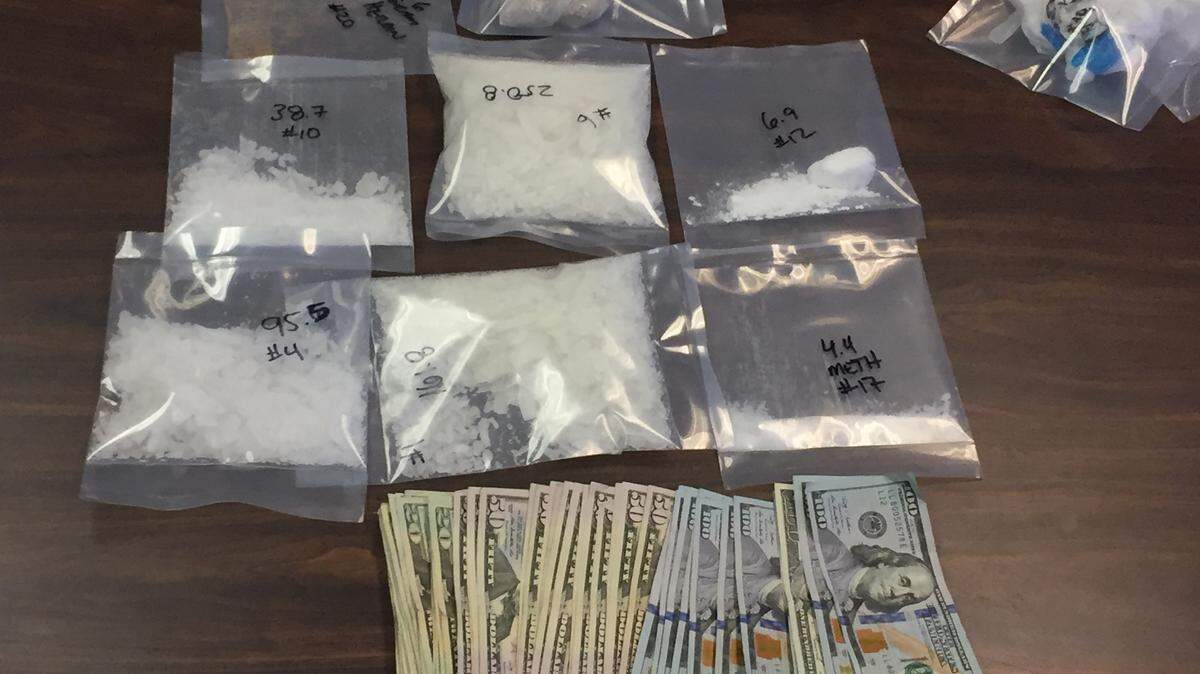 Nnearly 34 grams of heroin, more than 552 grams of methamphetamine and more than $2,200 in cash seized during the arrest of a drug trafficking suspect. 
 PHOTO PROVIDED.