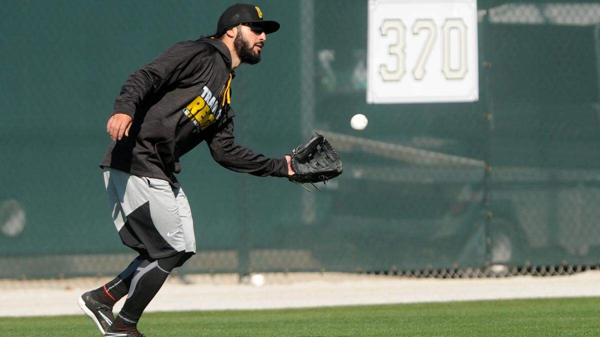 Pittsburgh Pirate Sean Rodriguez catches balls in the outfield during a short workout Thursday at Pirate City. 
 GRANT JEFFERIES/Bradenton Herald