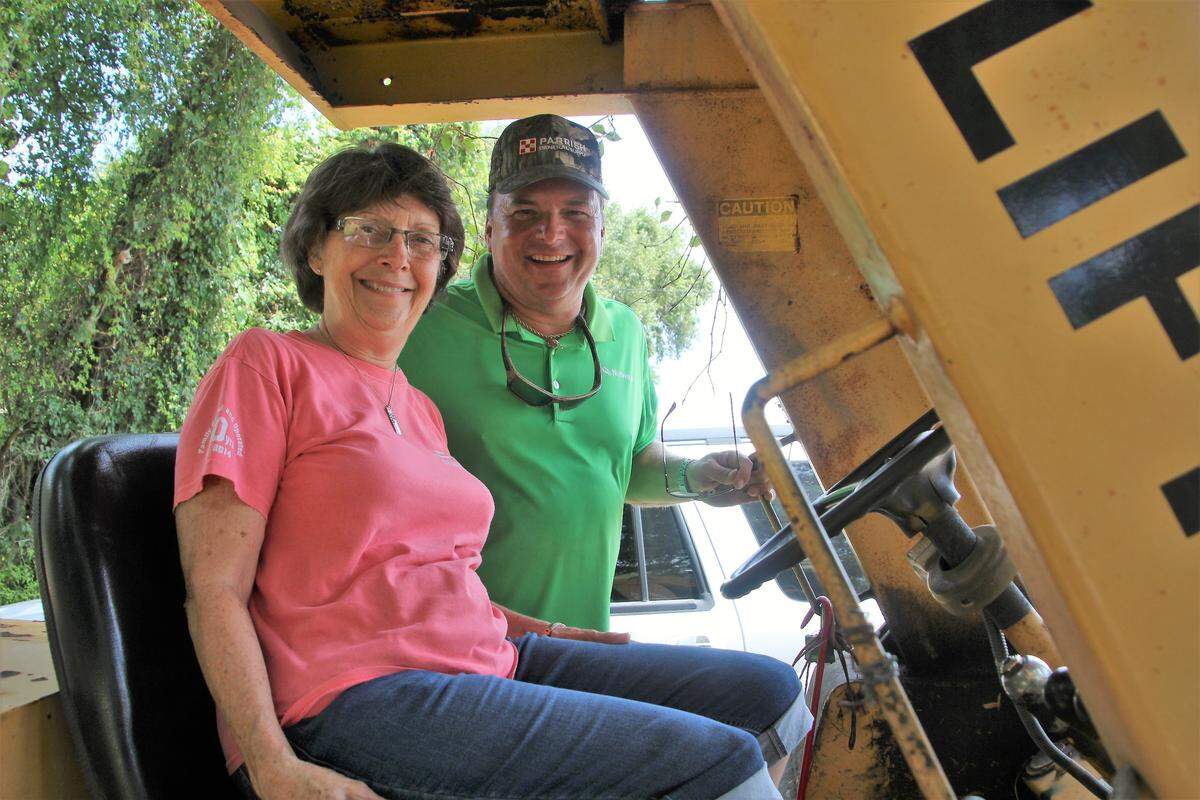 Linda Parks takes the seat of a forklift at Parrish General Supply. Also shown is her son, Jimmy Parks, who represents the next generation of operation of the store.