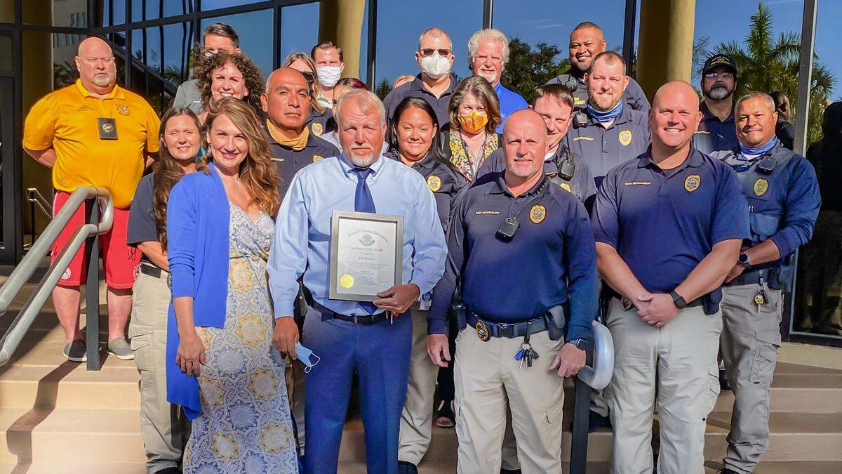 Jeff Bowman stands with a plaque awarded on Feb. 9, 2021, in a Facebook photo posted by Manatee County.