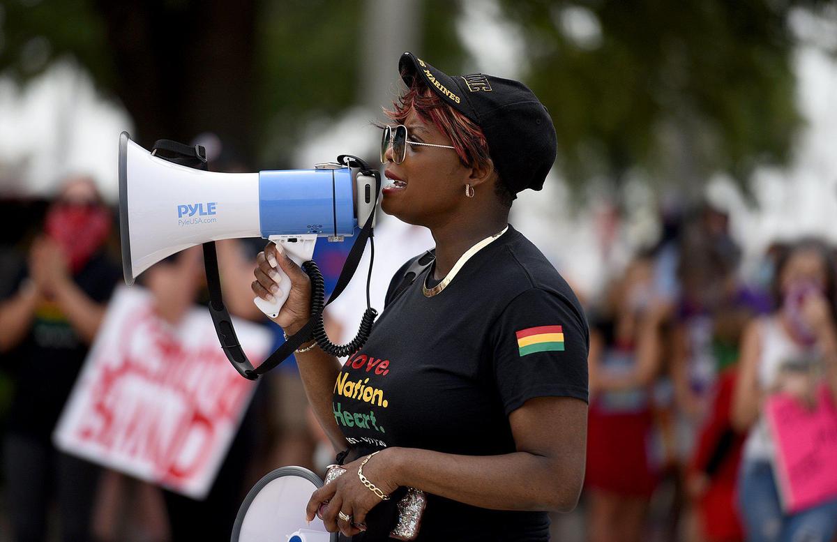 Xtavia Bailey, an organizer of One Love, One Nation, One Heart, march for justice, spoke to the group before they marched over the Green Bridge in remembrance of George Floyd. The group of about 200 made their way from Bradenton to Palmetto where they had speeches for racial justice and music.