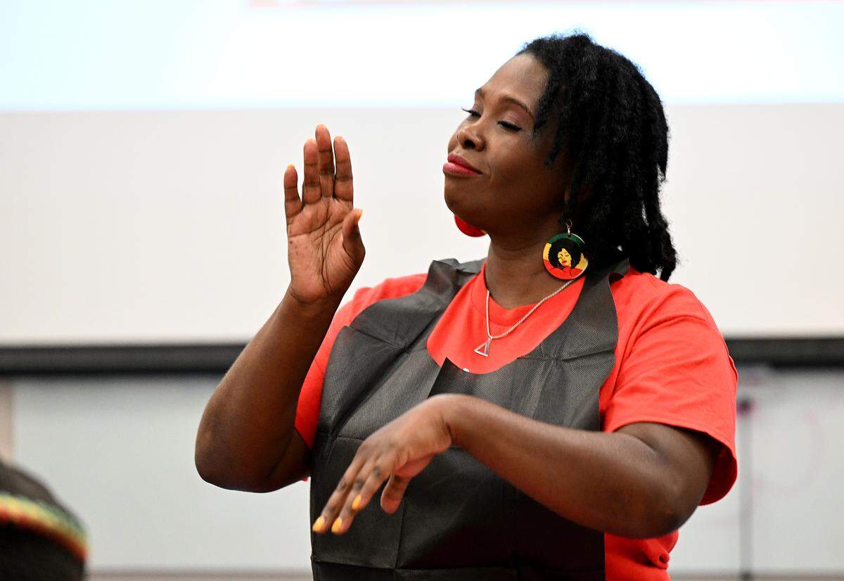 Dr. Sharon Jefferson, President of the Rosalyn Walton Education and Enrichment Services, Inc., leads activities for children.