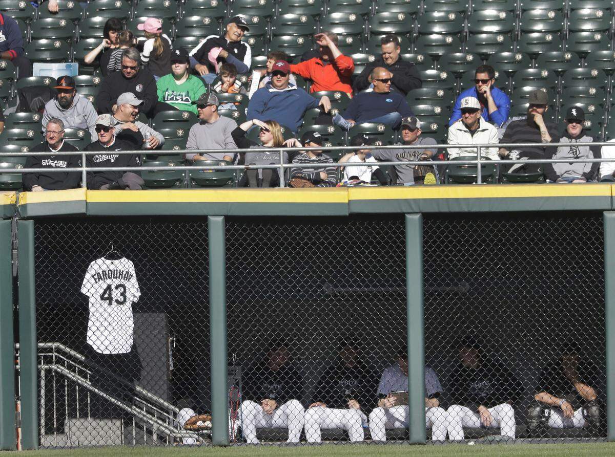 The jersey of Chicago White Sox relief pitcher Danny Farquhar hangs in the bullpen with teammates during the second inning of a baseball game against the Seattle Mariners Tuesday, April 24, 2018, in Chicago.