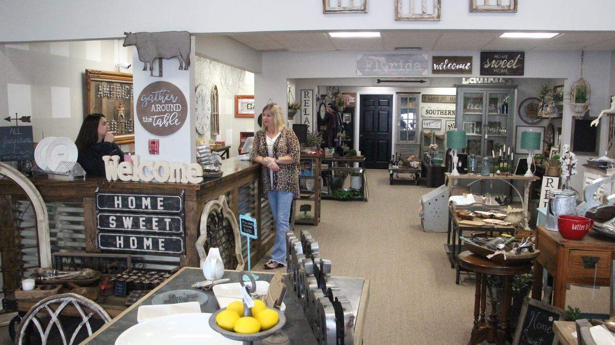Melissa Burns owns American Traditions Furniture and Decor, 433 10th Ave. W., Palmetto with her husband David. The business opened in October. She is shown above with Madison Conrad.