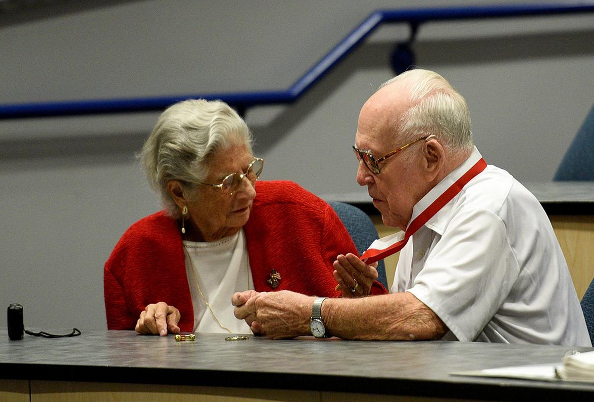 Marilyn Young admires the Governors Veterans Service Award medal presented to her husband, Dale. Young, a decorated World War II Veteran, served in the US Army from August 1944 to November 1946. Young is the father of Trooper Jeff Young, who was killed in the line of duty while attempting to arrest a drug courier during a traffic stop in Manatee County on August 18, 1987.