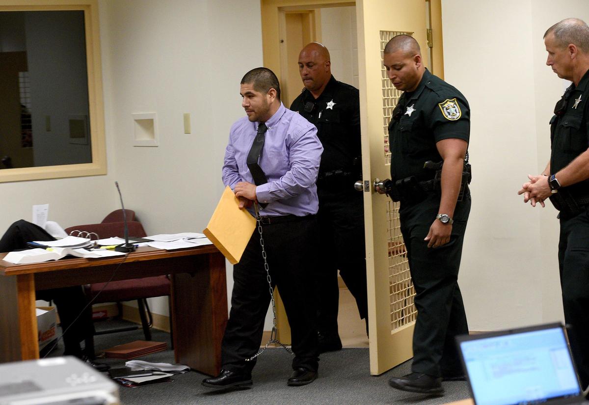 Deputies escort Orlando Valenzuela to his seat in the courtroom at the Manatee County Jail during his resentencing hearing. Valenzuela was originally sentenced to life for the 2nd degree murder of 9-year-old Stacy Williams.