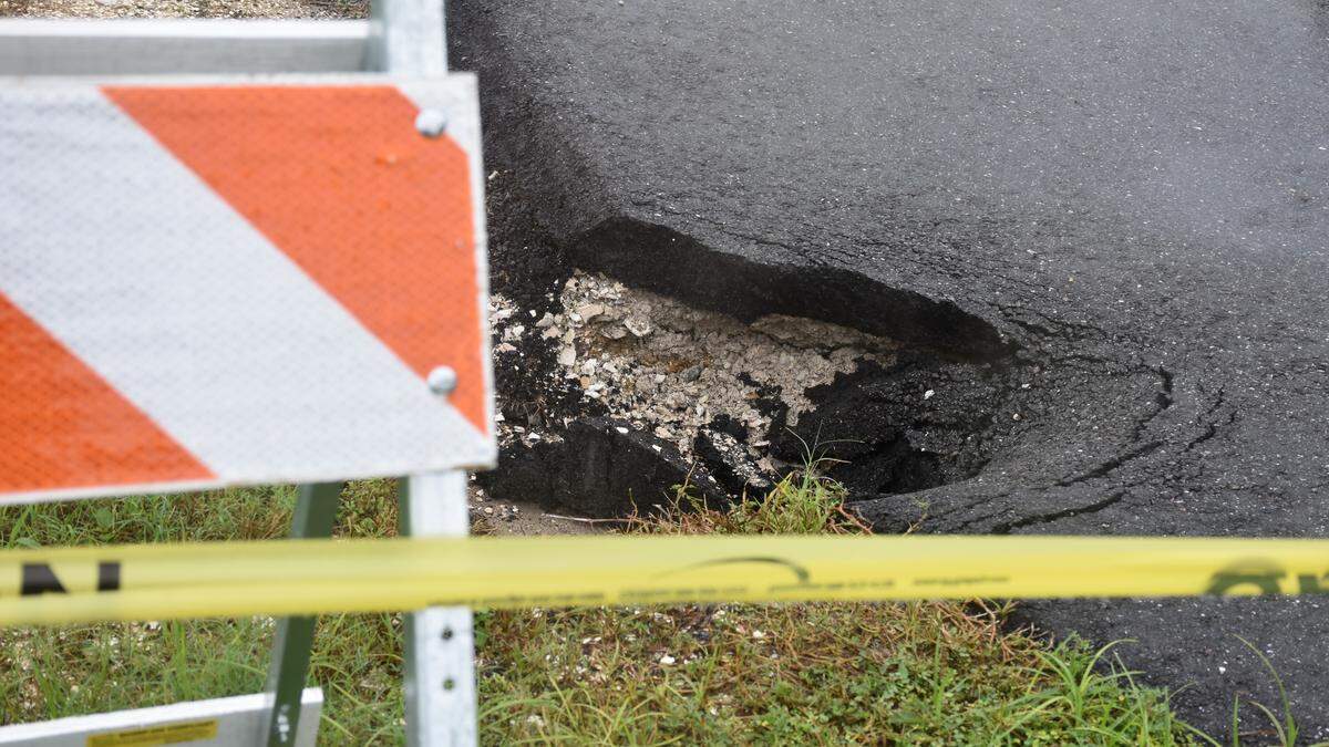 A high volume of water appears to have caused a small amount of asphalt on either side of the roadway to crumble away along a small portion of Ninth Street West in Bradenton near the DeSoto Square Mall. In a statement, county staff said the road would be closed until storm system repairs are completed.