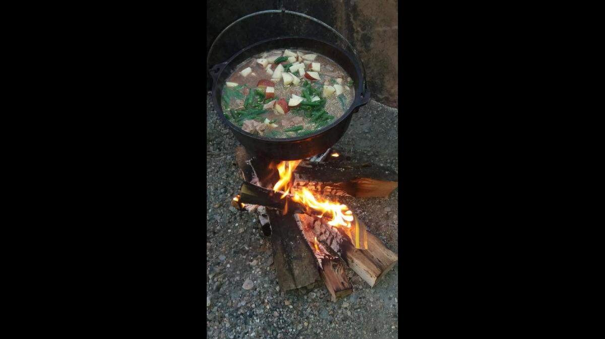 Fresh potatoes, green beans, onions and chunks of steak went into a stew cooked over an open fire on a recent Friday night for the Eichers.