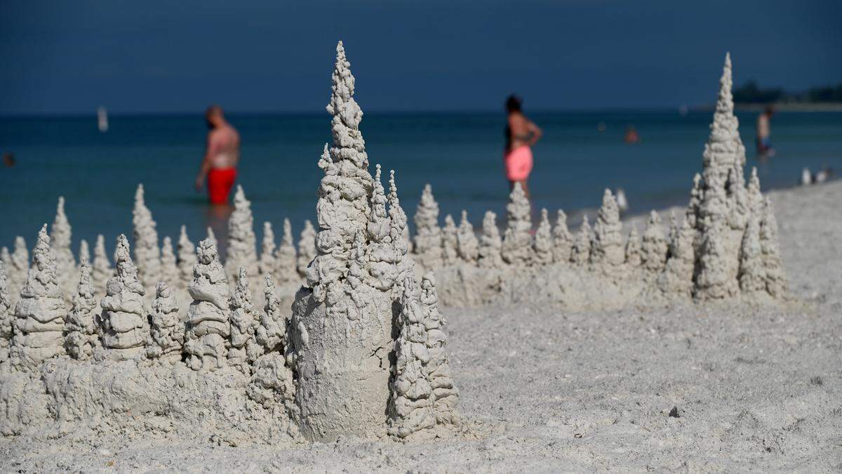 Bathers enjoy the waters of the Gulf on Monday morning at the Manatee County Public Beach as Hurricane Ian approaches.