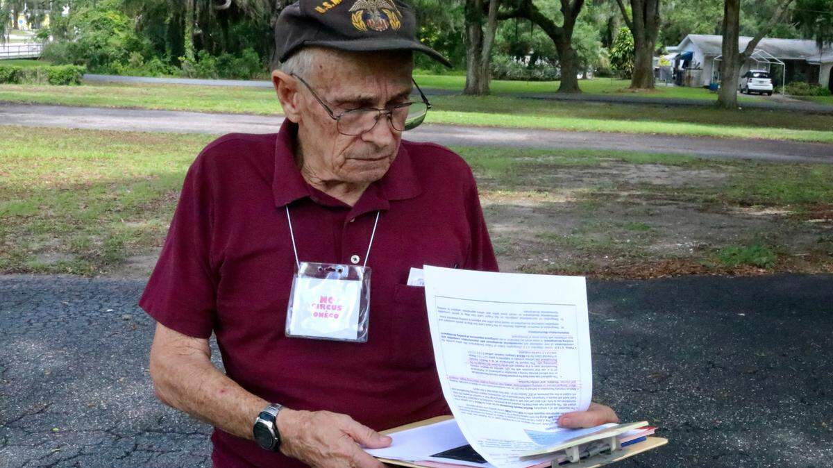 Neighbors are ramping up their opposition to a circus locating in Oneco as the Manatee County Commission prepares to vote on a zoning change June 2​ requested by Cirque Italia. Jo Bell was collecting signatures on a petition on June 1.