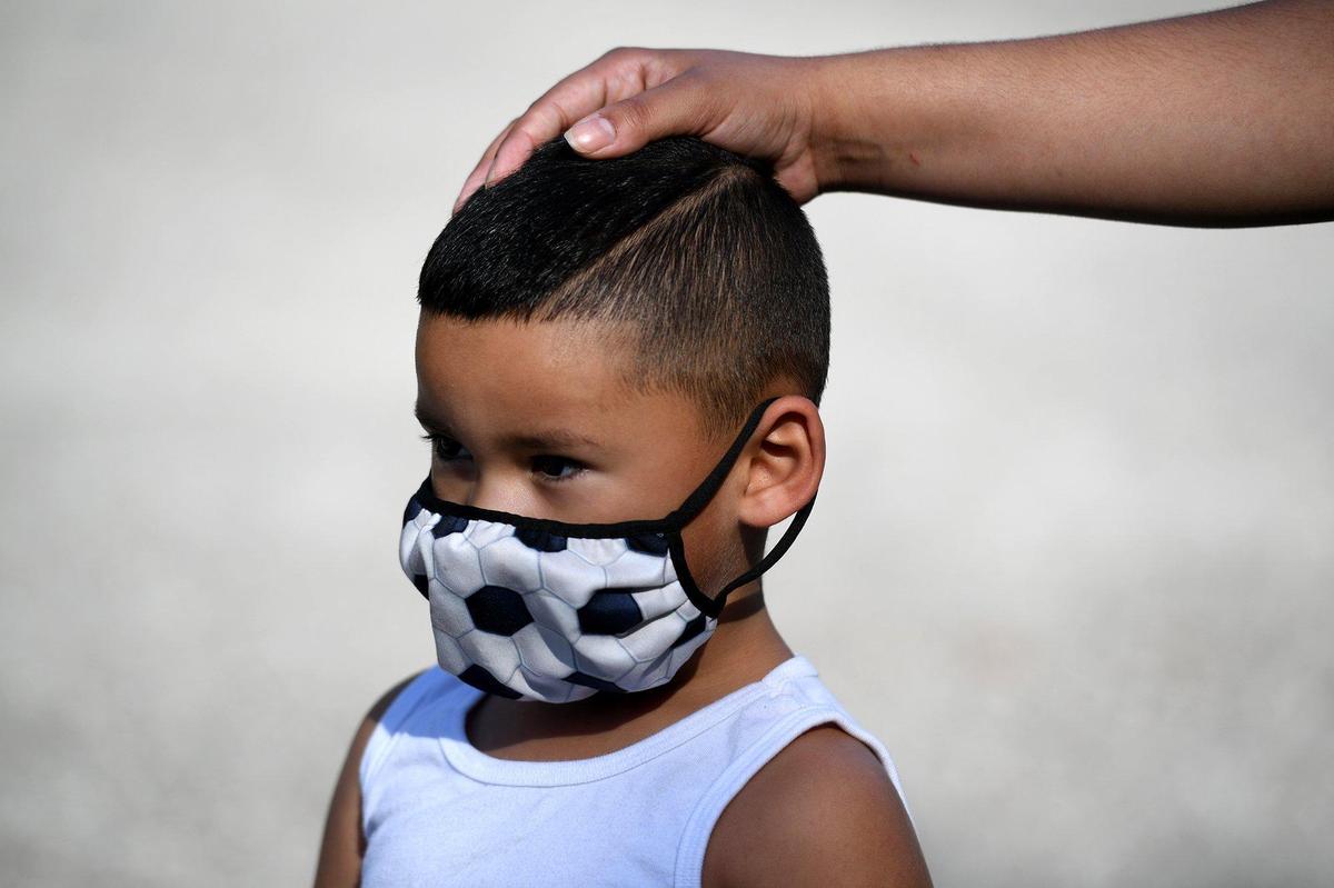 Ezekiel Rosales, 4, gets a COVID-19 test sponsored by the State of Florida at Lincoln Park in Palmetto.