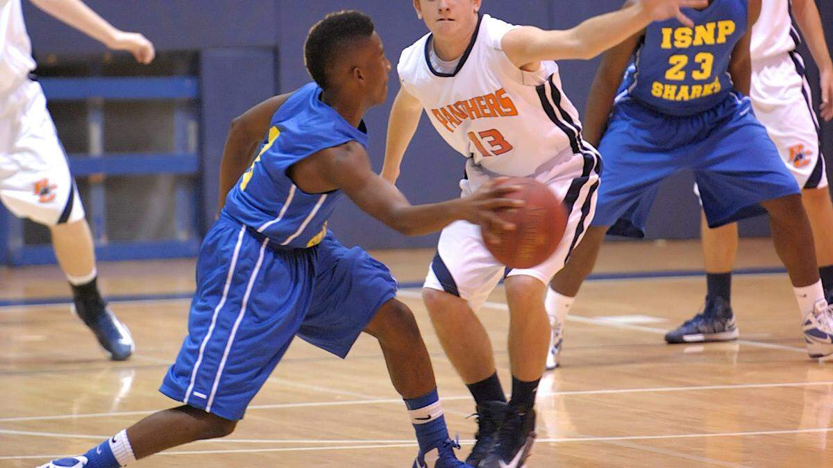 Bradenton Christian's Jake Lister, right, guards Imagine School North Port's Tony Anderson during the Smoothie King Classic on Dec. 27, 2012, night at Bradenton Christian. HERALD FILE PHOTO