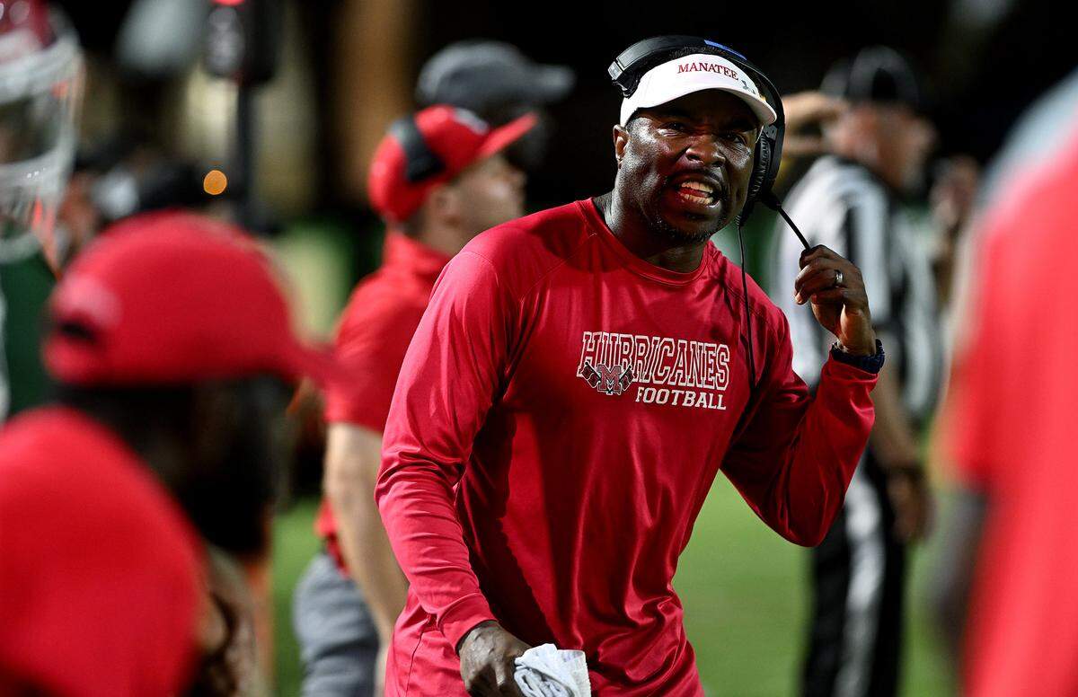 Manatee High head football coach Jacquez Green calls to players while playing Venice High in Venice on Friday, Oct. 6, 2023.
