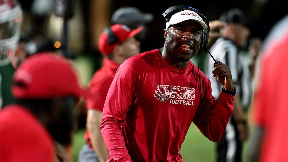 Manatee High head football coach Jacquez Green calls to players while playing Venice High in Venice on Friday, Oct. 6, 2023.