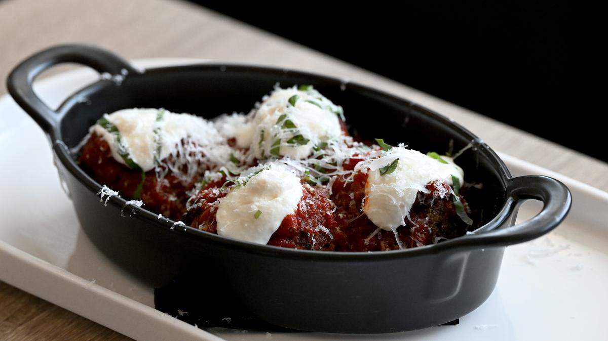 The wood-fired Wagyu meatballs with roasted tomatoes, house ricotta, fresh basil and pecorino at iDalia in Parrish on May 19, 2026.