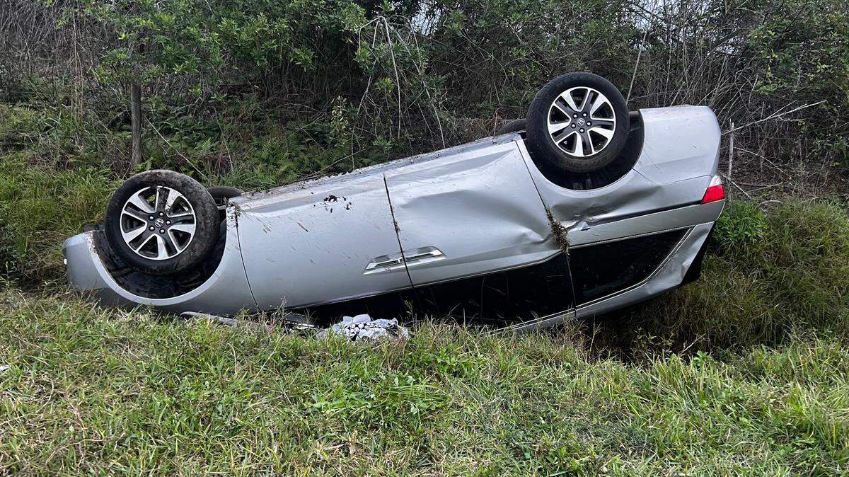 An overturned van rests off Verna Bethany Road in Myakka City after a hit-and-run crash that left three children seriously injured, according to the Florida Highway Patrol.