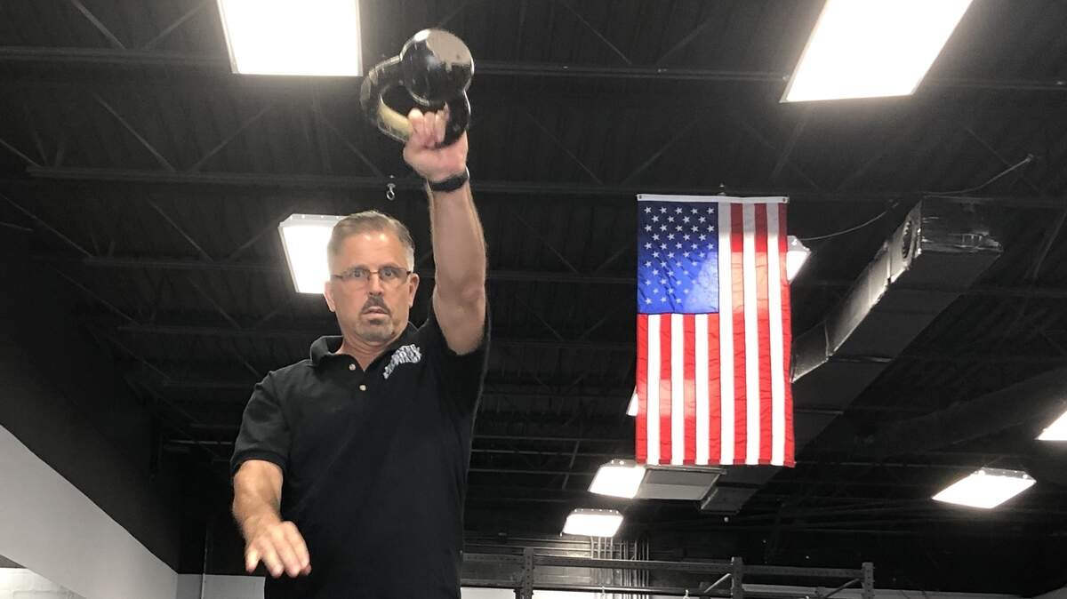 Steve Valley, shown above working out with a kettlebell, recently opened Manatee Fit Body Boot Camp, 5917 Manatee Ave. W, Suite 107, and is following protocols to keep members safe from COVID-19.