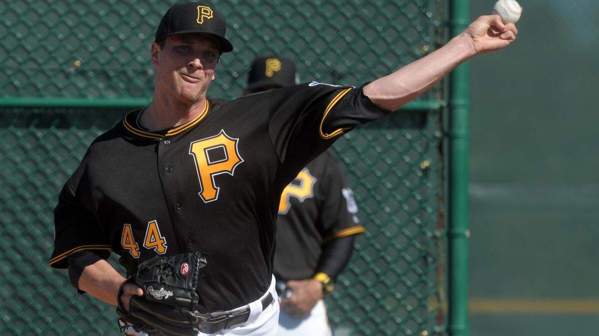 Pittsburgh Pirate Tony Watson pitches during the official first day of spring training workouts Friday at Pirate City in Bradenton. He and his wife own a home in Lakewood Ranch. 
 GRANT JEFFERIES/Bradenton Herald