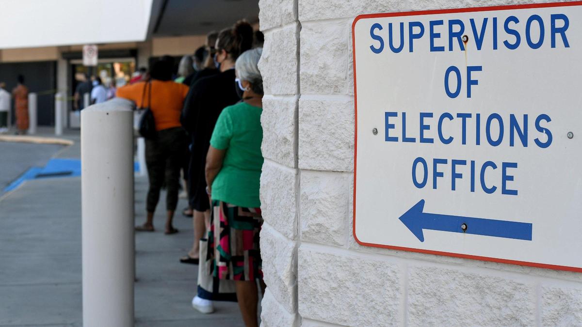 Voters line up outside the Supervisor of Elections office in Bradenton for early voting.