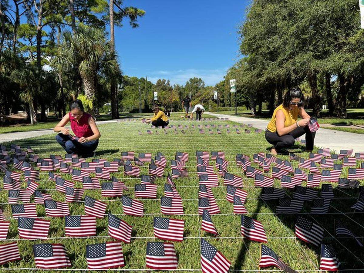 Volunteers on Tuesday planted 2,977 small American flags on the USF Sarasota-Manatee campus courtyard, one for each of the people who died in the attacks.