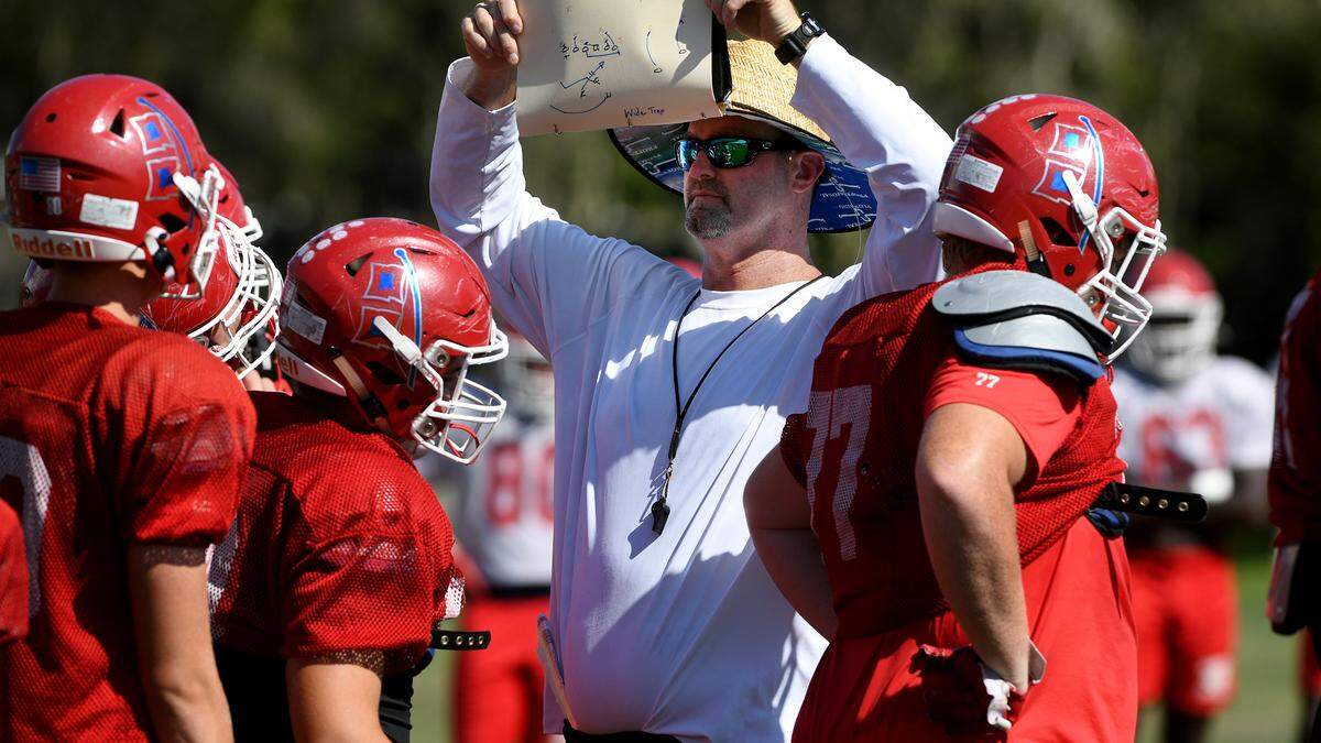 Keith McMahon works with Manatee High football players during practice at on Wednesday, Sept. 21, 2022.