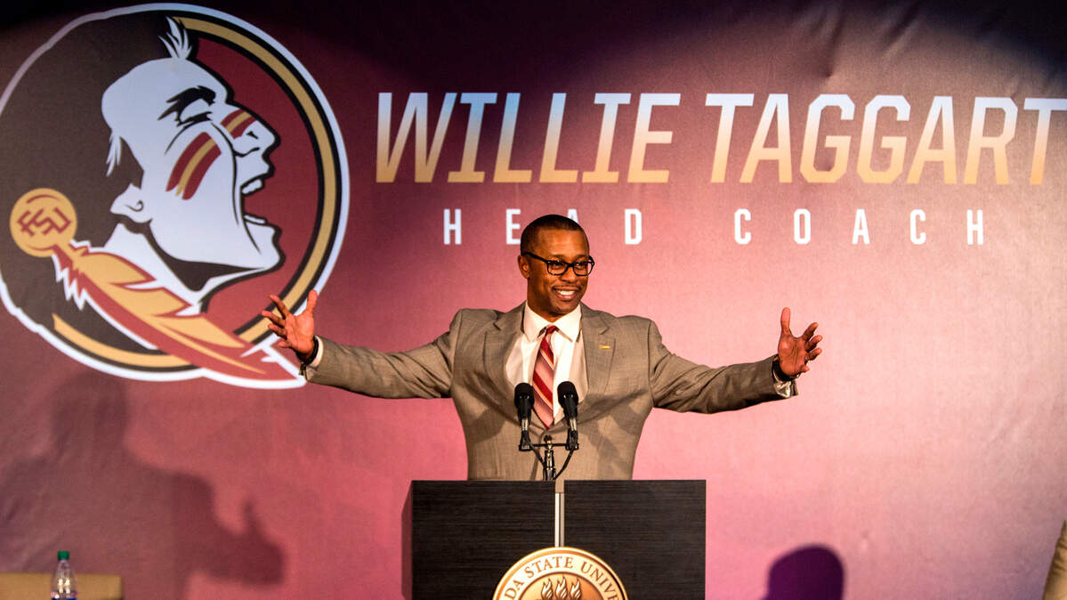 In this Dec. 6, 2017, file photo, Willie Taggart gestures as he is introduced as Florida State's new football coach during an NCAA college football news conference in Tallahassee, Fla.