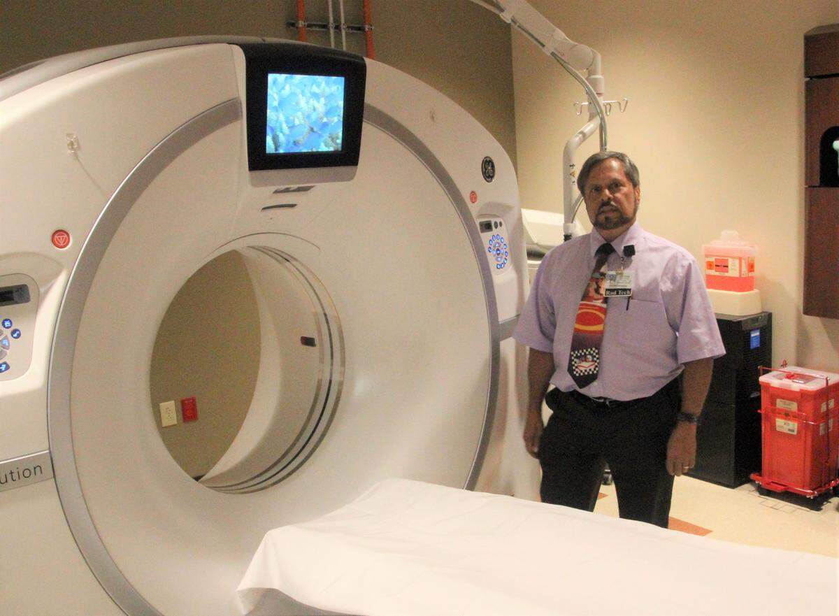 Peter Pellegrino, CT tech, is shown with the 65-slice CT scanner at Doctors Hospital of Sarasota ER in Lakewood Ranch.
