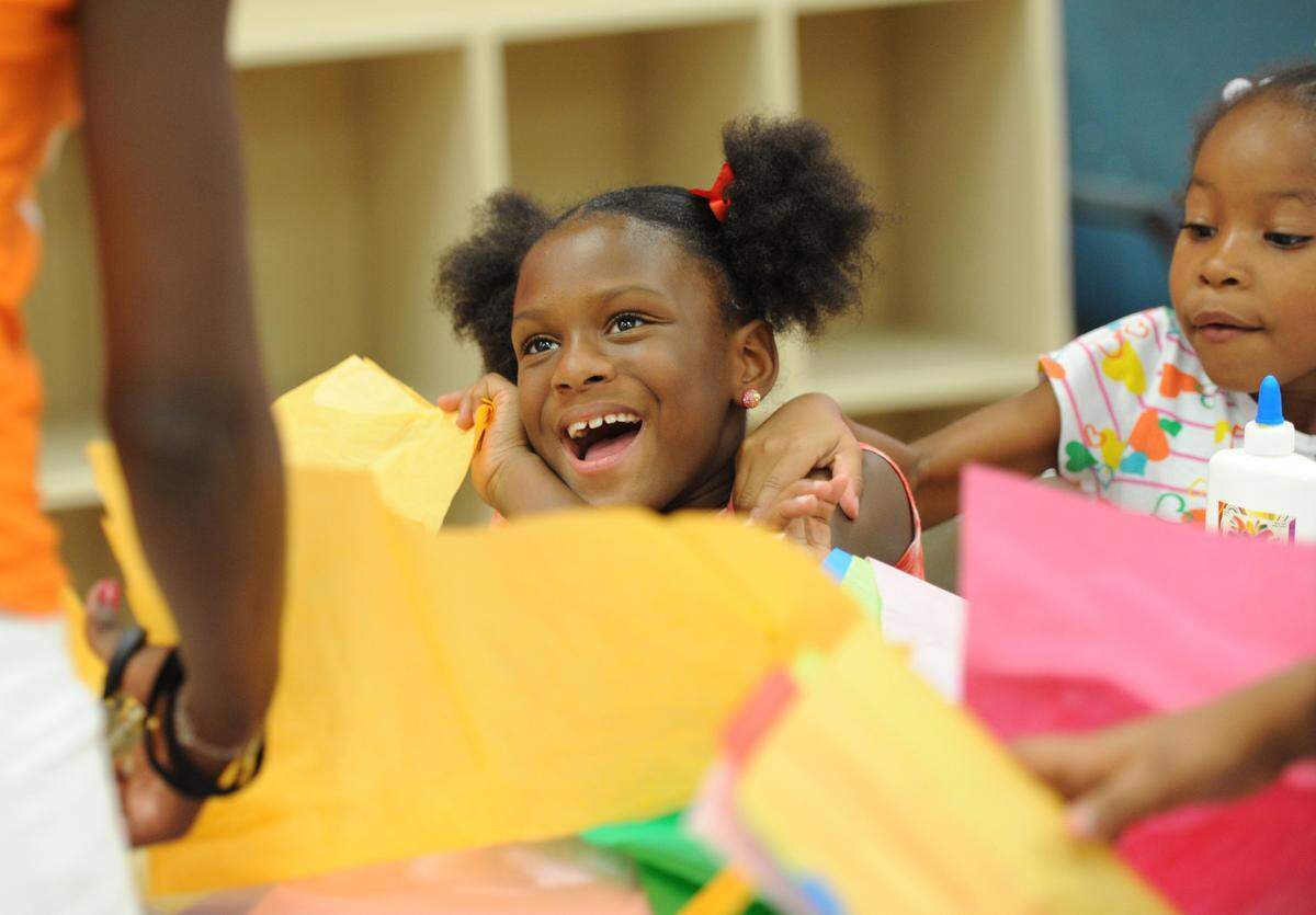 Thesha Dukes and Kennedi Randall enjoy a craft project at the Rubonia Community Center in 2012.