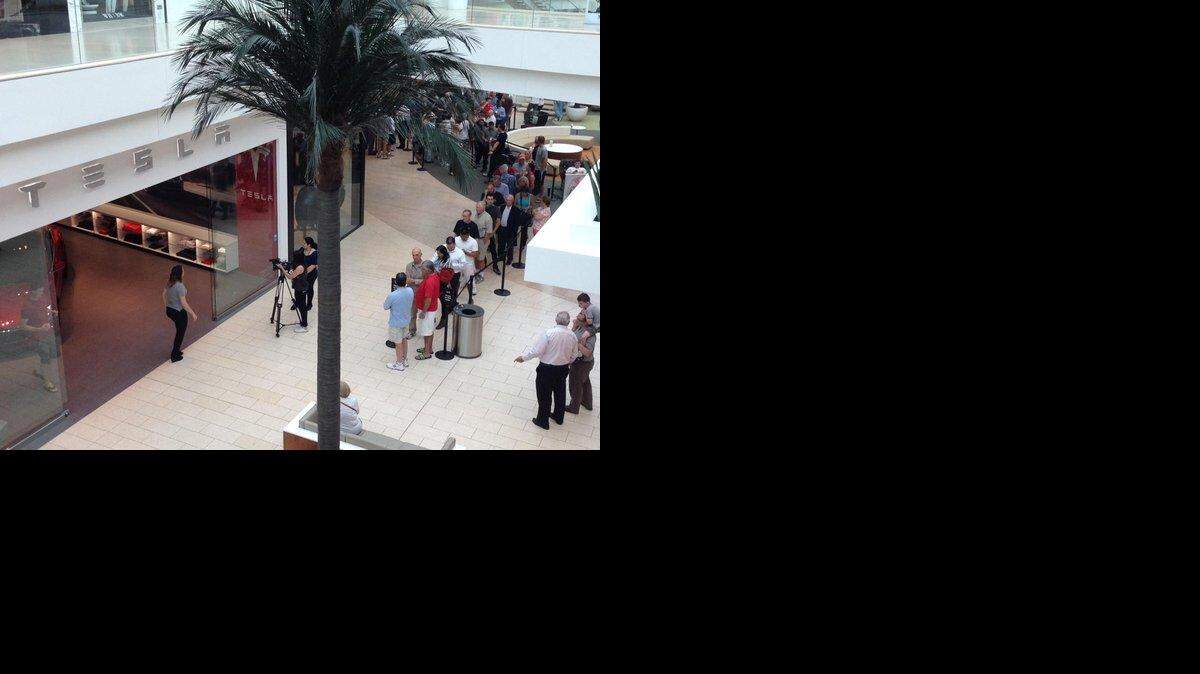 Crowd lines up at Tesla Sarasota at the Mall at University Town Center to sign up to buy the new Model 3.