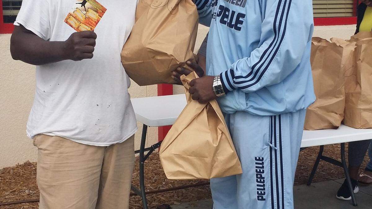 Volunteers with Life Changers International World Ministries of Palmetto distribute food to the needy last year at the conclusion of the Mayor's Feed the Hungry Food Drive, which starts Monday, Nov. 9 and runs through Nov. 20 this year. 
 PROVIDED PHOTO