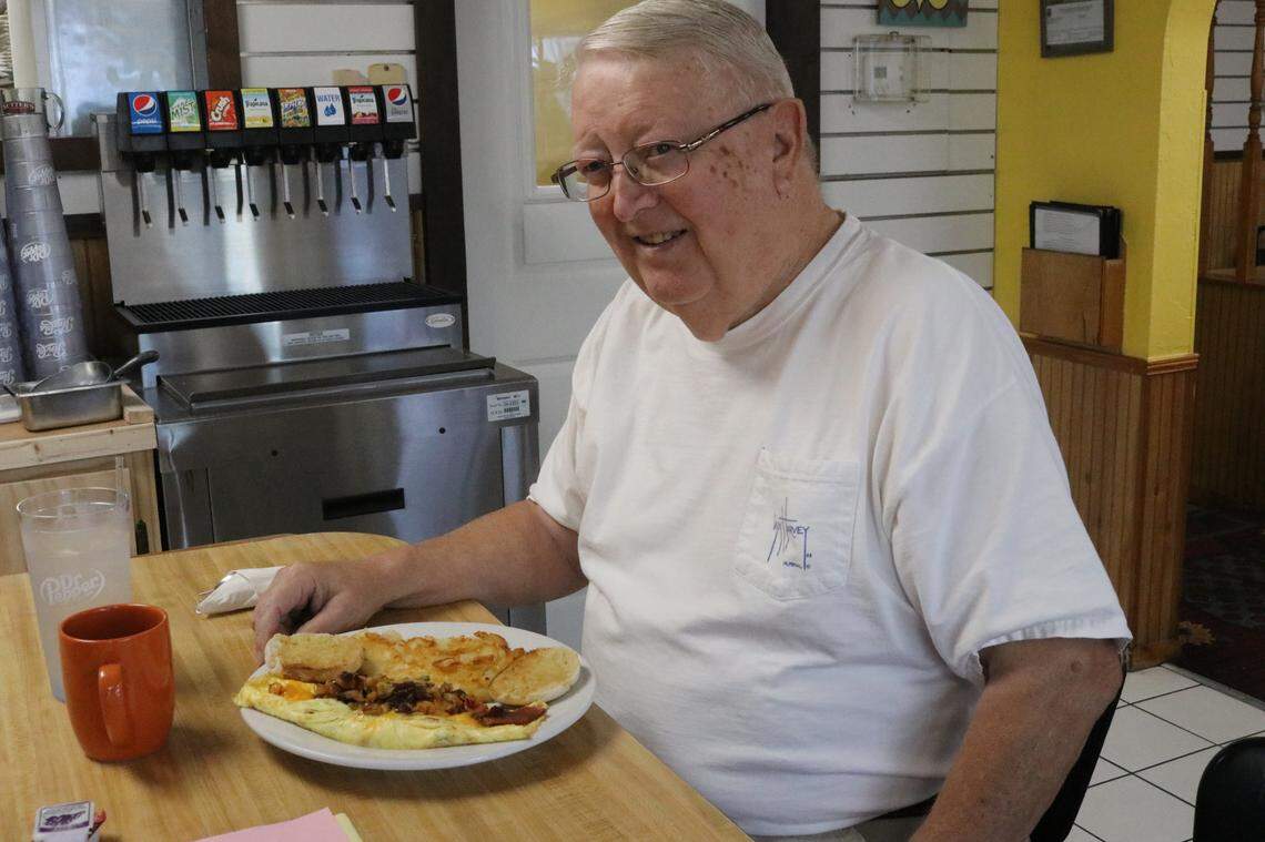 Harold Loper prepares to dig into a Caesar Omelet at Caesar’s Breakfast Cafe, 1808 Cortez Road W., Bradenton, in the All Star Plaza.