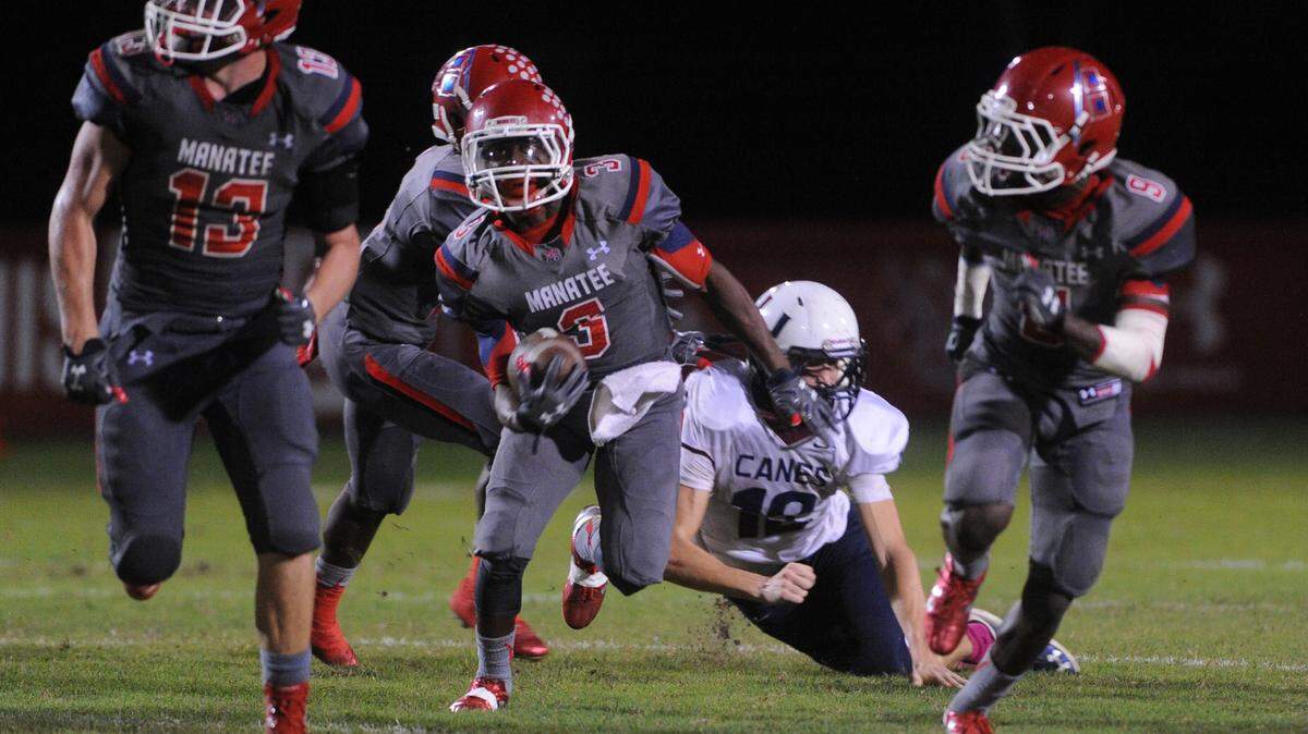 Manatee High's Kavious Price takes runs by the Palm Harbor University defense for a touchdown during Friday night action at Hawkins Stadium in Bradenton. 
 GRANT JEFFERIES/Bradenton Herald