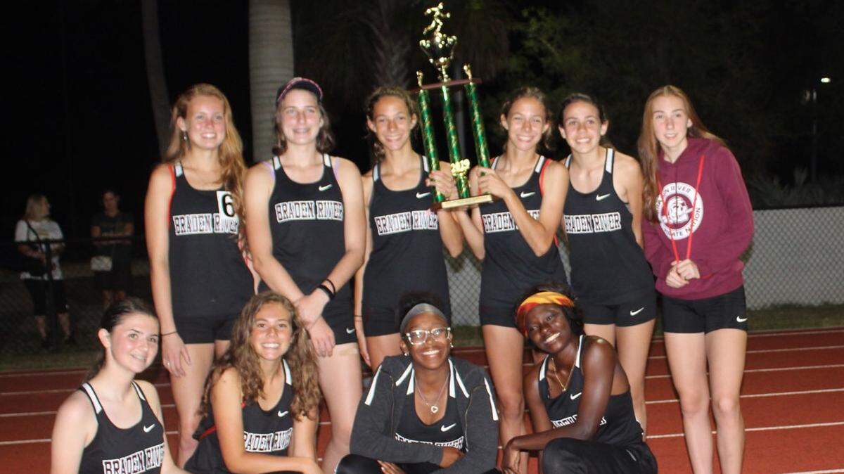 The Braden River girls track and field team poses with the trophy Thursday after winning the Manatee County championship.