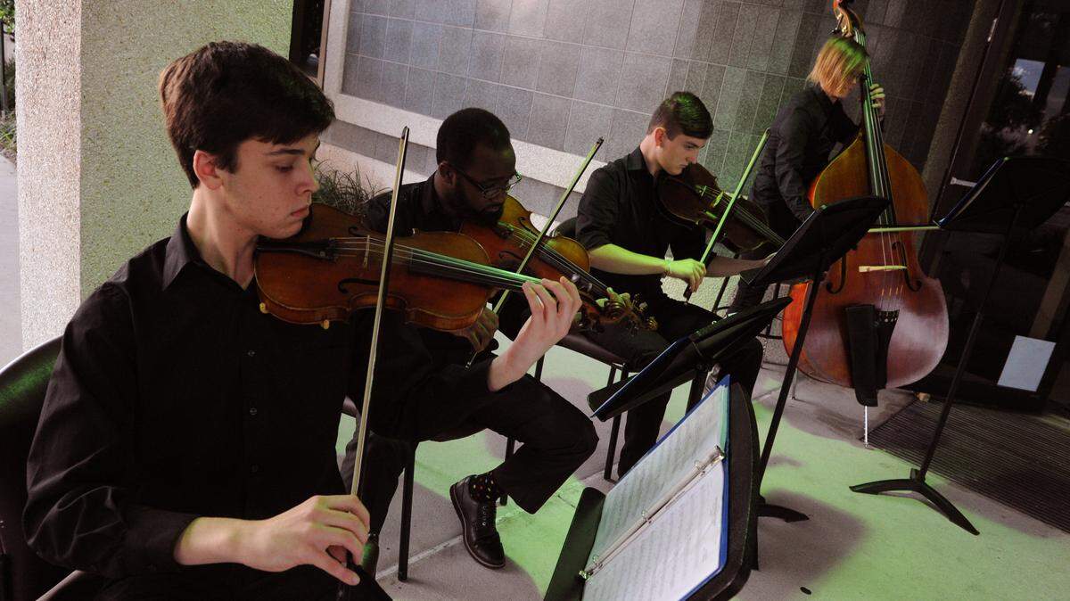 The Manatee High School orchestra plays Christmas music as people enter the Manatee County School Board meeting Tuesday.GRANT JEFFERIES/Bradenton Herald