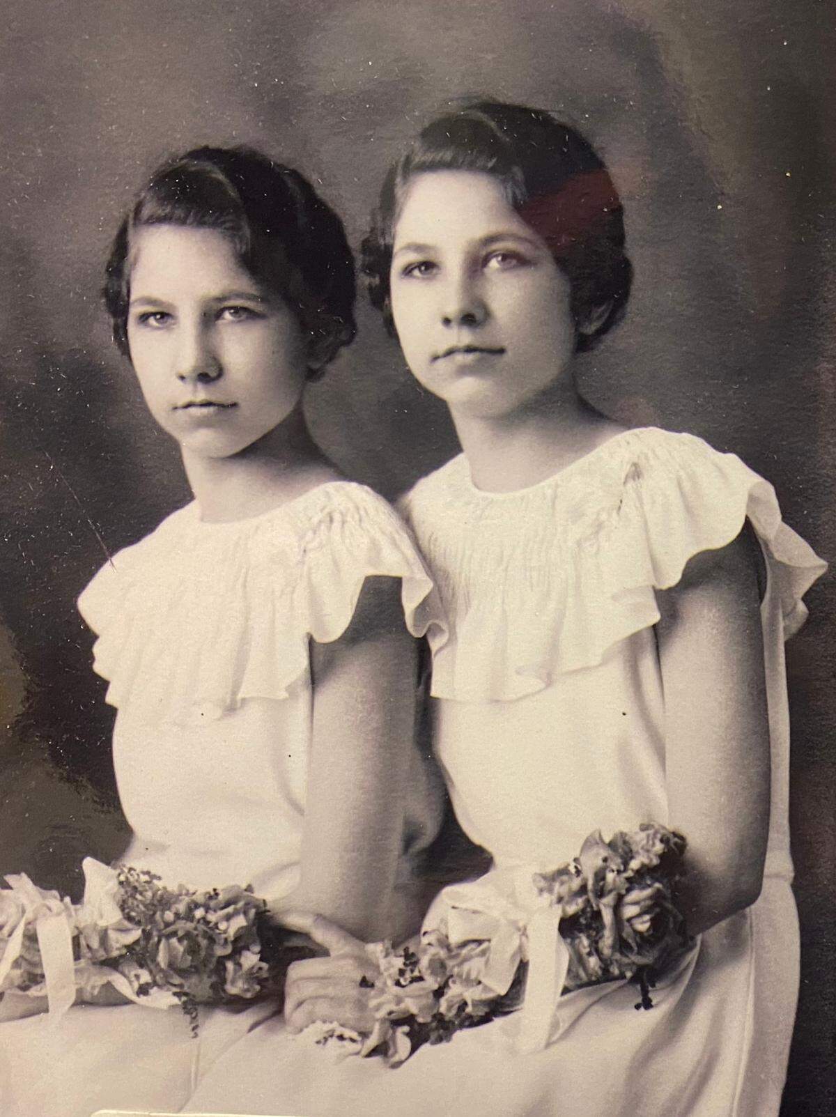 Twin sisters Millie and Marian would grow up to serve as nurses during World War II.