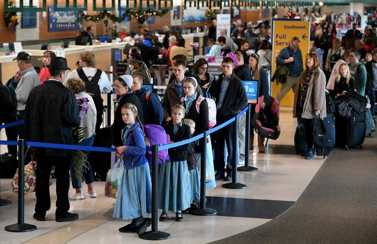 Passengers line up at the ticket counters at the Sarasota Bradenton International Airport where 13 arrivals and 12 departures were cancelled on the morning of Dec. 27, 2022.