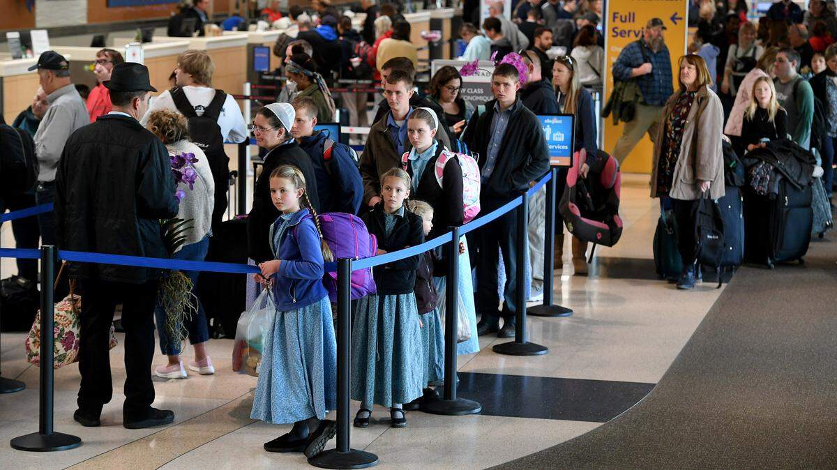 Passengers line up at the ticket counters at the Sarasota Bradenton International Airport where 13 arrivals and 12 departures were canceled on the morning of Dec. 27, 2022.