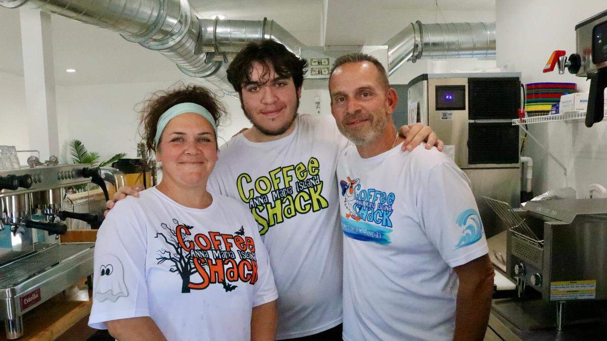 Michelle and Steve McSweeney, shown 10/24/2023, own and operate Anna Maria Island Coffee Shack, 5500 Marina Drive, Holmes Beach. They son, Max (center), 16, helps at the shop.