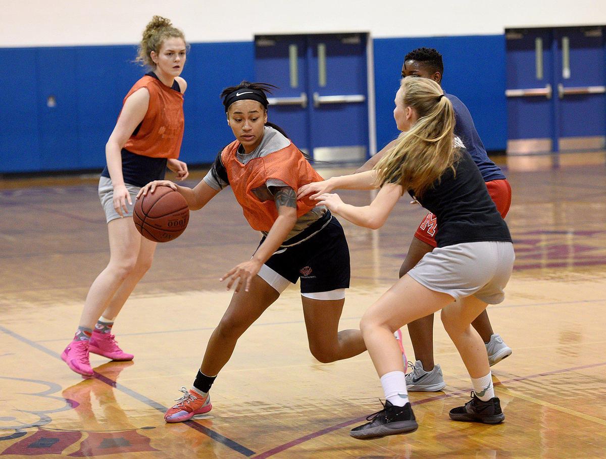 Manatee girls basketball player Ophelia Lidge practices in the gym Thursday as they ready for the Class 6A-District 10 tournament.