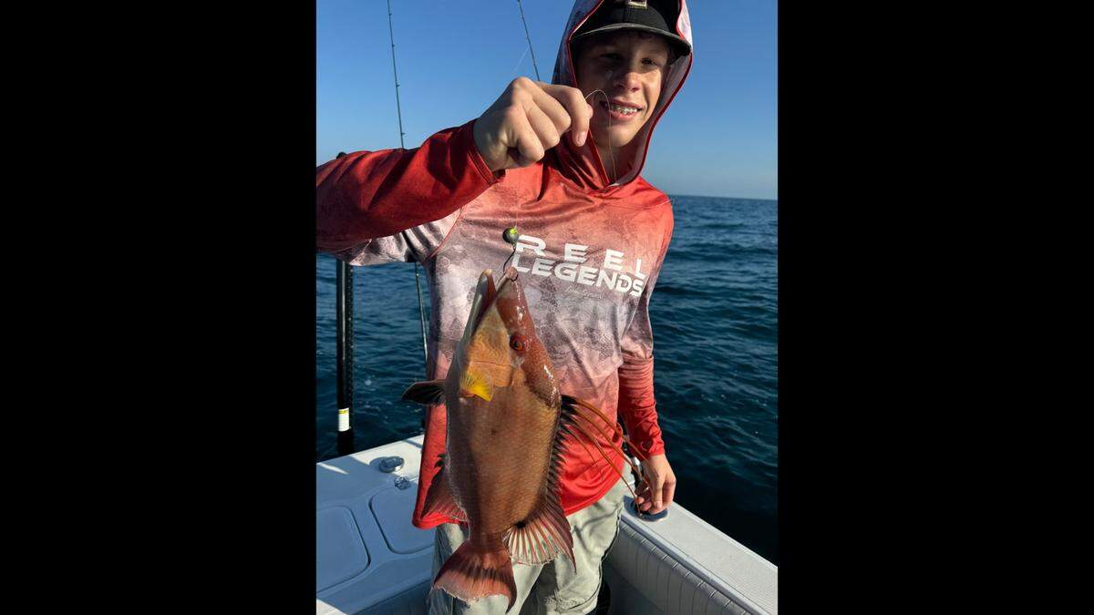 Charlie Womble poses with a hogfish caught in the Gulf of Mexico while fishing offshore for the first time with Jon Chapman on Tuesday, Dec. 31, 2024.