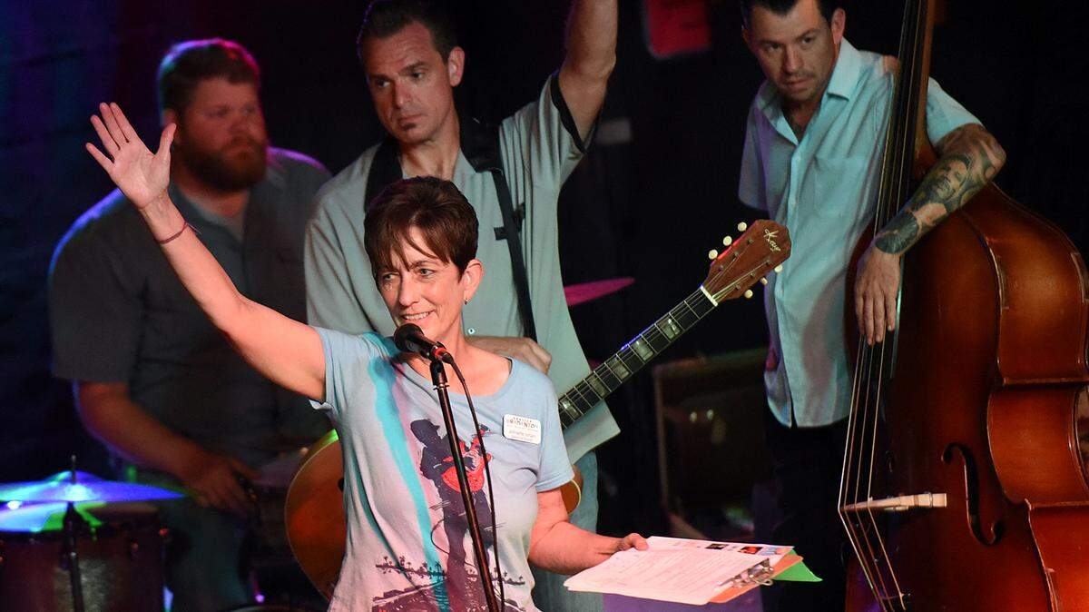 Johnette Isham of Realize Bradenton on stage to make announcements with Doug Deming and the Jewel Tones at Ace’s Lounge. Isham, the founding executive director of Realize Bradenton, died recently according to a release from Realize Bradenton