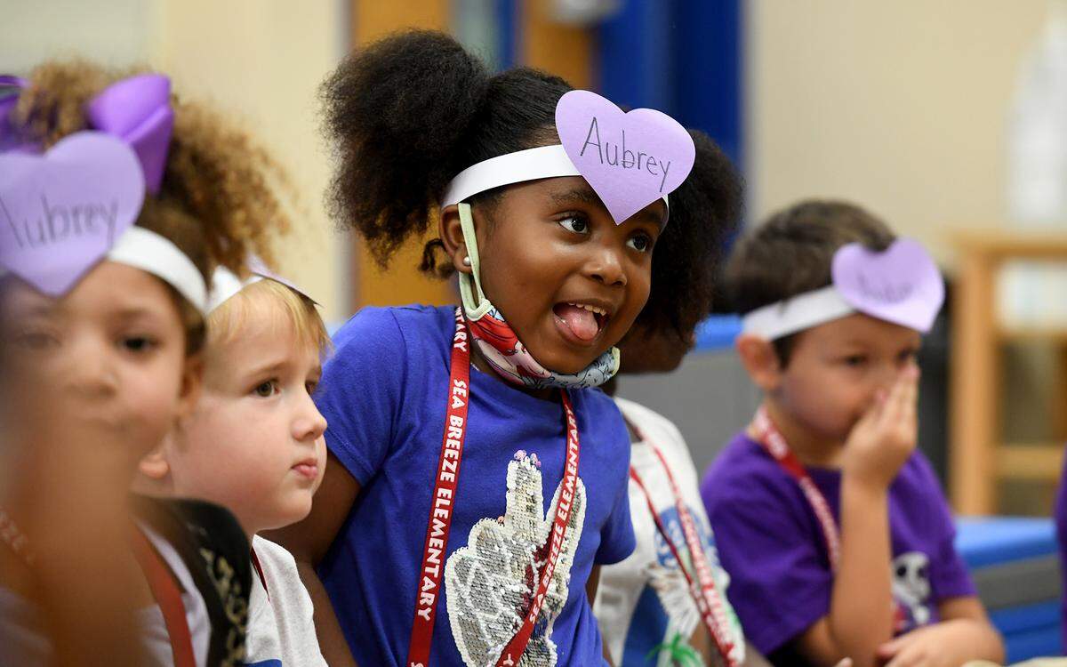 10/15/21—Students from Sea Breeze Elementary School dressed in purple for “Aubrey Day,” raising money and awareness for a student diagnosed with a rare cancer.