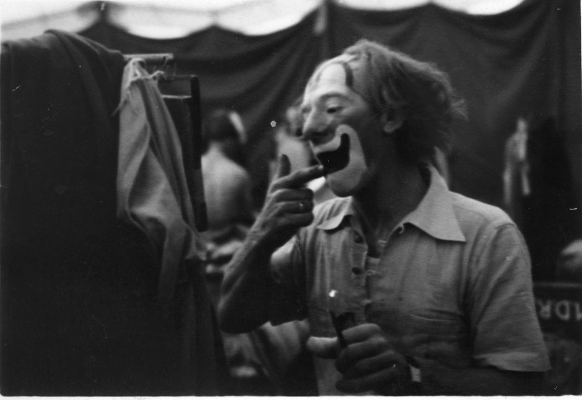 Famous Auguste clown Lou Jacobs putting on makeup in 1938. An Auguste clown is a character-type that is often a joker or a fool.