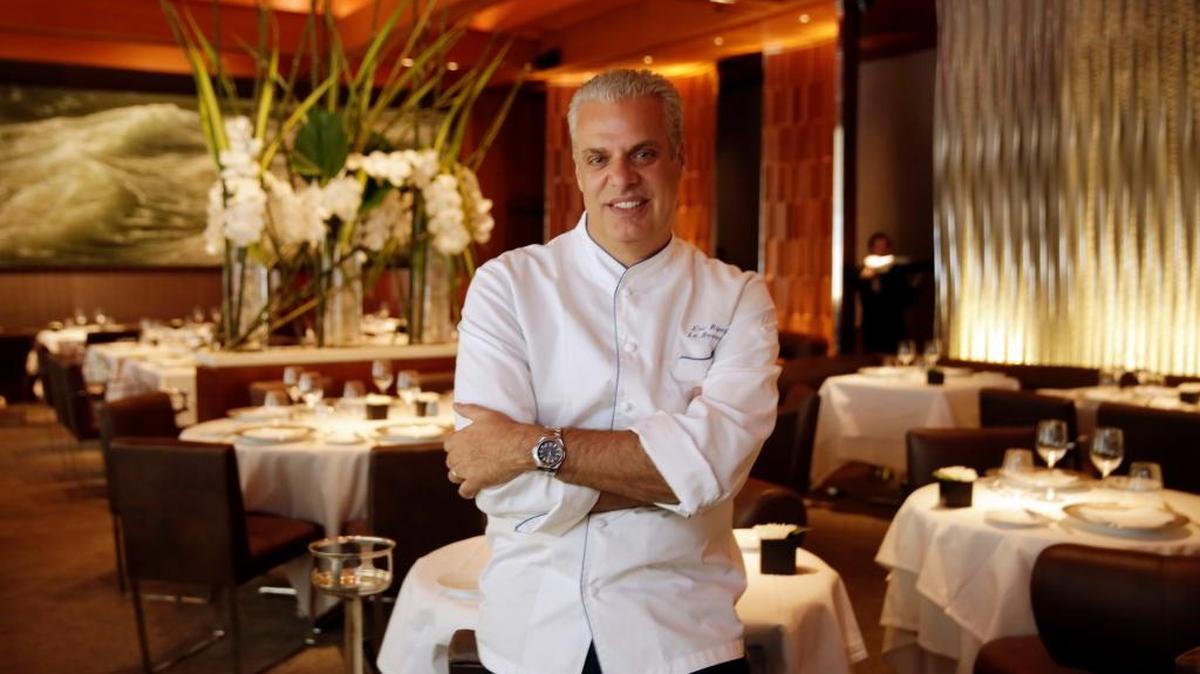Chef Eric Ripert, poses for photos in the dining room of his restaurant, Le Bernadin, last week in New York. Ripert recalls an uphill climb to culinary greatness in an engrossing new memoir, “32 Yolks.”