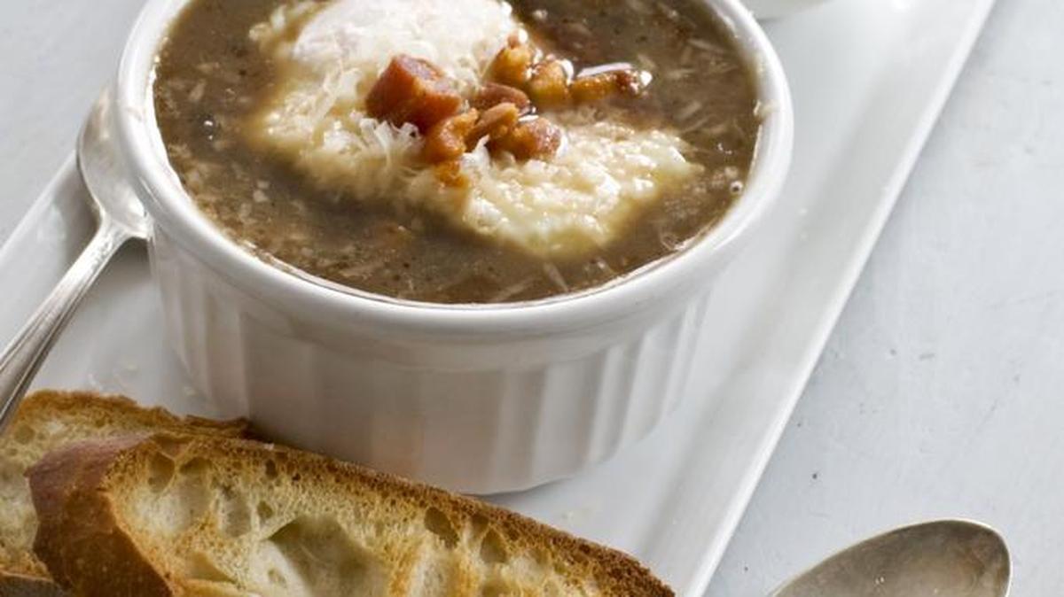 Italian-style onion soup is topped with a poached egg.