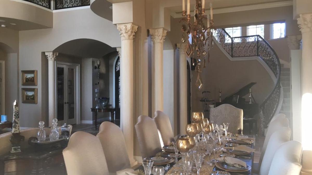 Dr. Richard and Susan Steinberg are opening their 9,266-square-foot home in Palmetto, here revealing the grand dining room and foyer, to the Entre Nous Club's 39th Annual Holiday Tour of Homes. The Steinbergs celebrate Hanukkah and the house will have many reminders of the holiday.