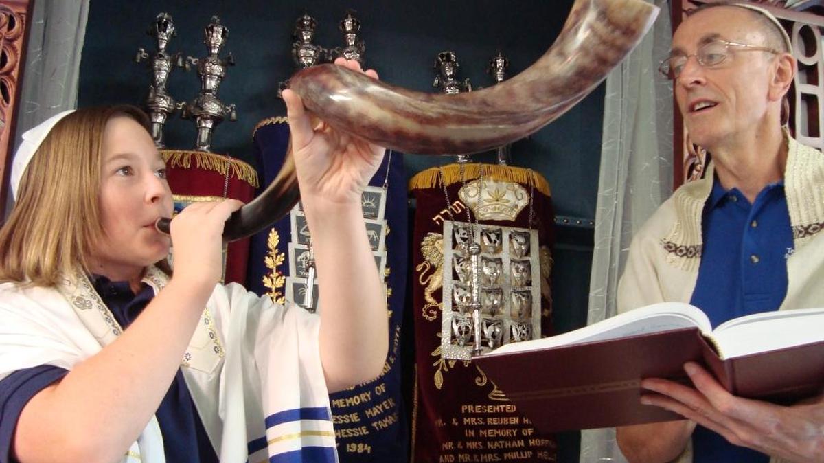 A Temple Beth El student sounds the shofar, or Ram’s Horn, in preparation for a past Jewish High Holiday service.