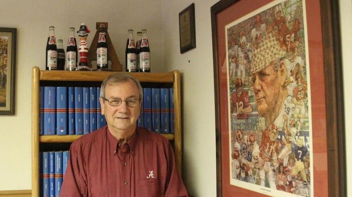 Pastor Larry Pritchett has served Palm View First Baptist Church for 40 years. He is shown in his office with some of his Alabama football memorabilia.