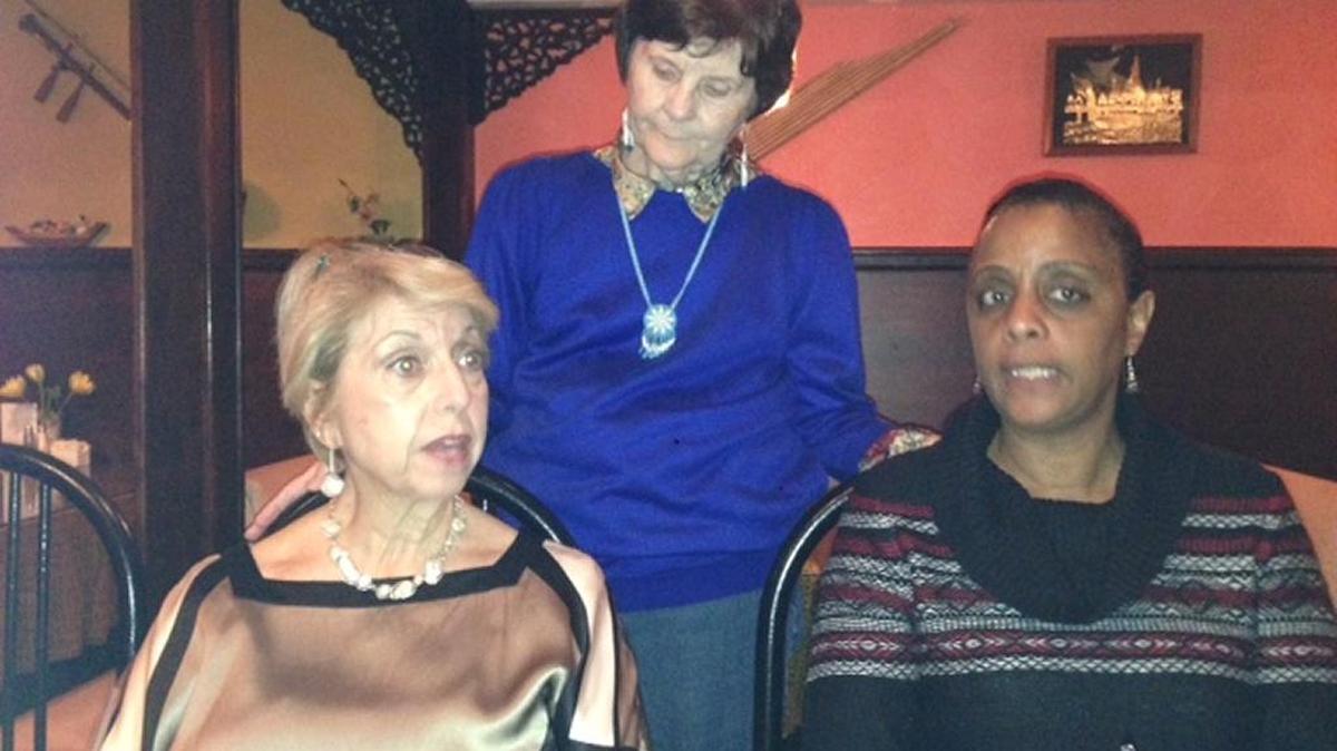 From left, Baha’is Joan Irwin, Barbara Bostian and Dr. Teresa Pettersen sing together during a Ayyam-i-Ha celebration in the Thai Lotus Restaurant in Bradenton in 2015.